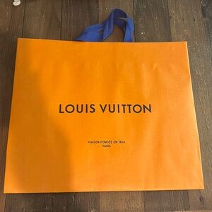 A Louis Vuitton bag empty.